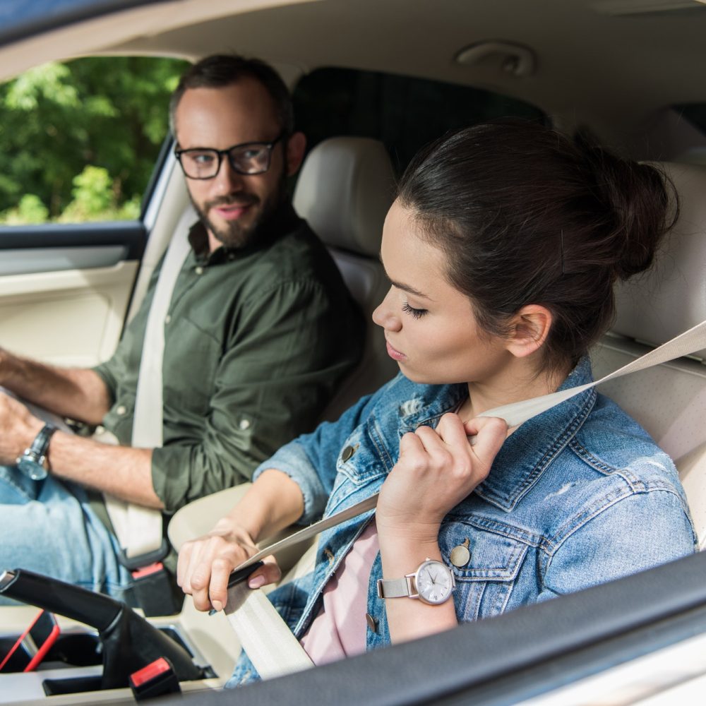 student-fastening-seat-belt-in-car-during-driving-test.jpg student-fastening-seat-belt-in-car-during-driving-test.jpg